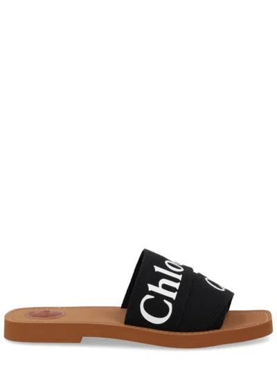 Chloé Woody Flat Logo Ribbon Slide Sandals In Black