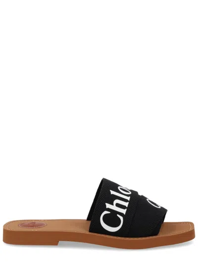 Chloé Woody Flat Logo Ribbon Slide Sandals In Black