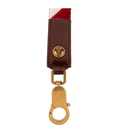 Versace Triangular Serrated Keychain In Orange