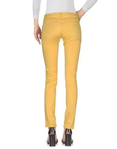 Shop Happiness Denim Pants In Yellow
