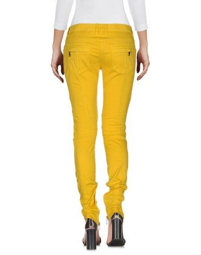 Shop Balmain Denim Pants In Yellow