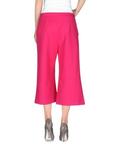 Shop Msgm Cropped Pants & Culottes In Fuchsia