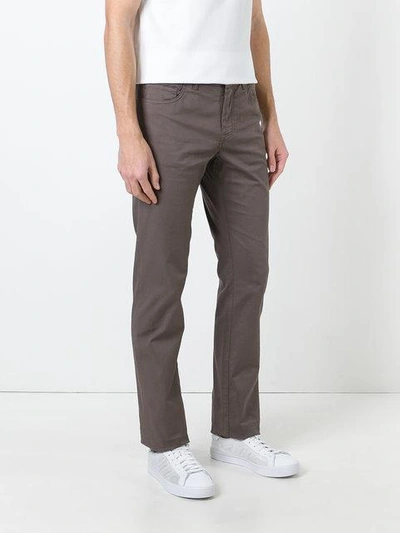 Shop Brioni Tapered Trousers In Brown