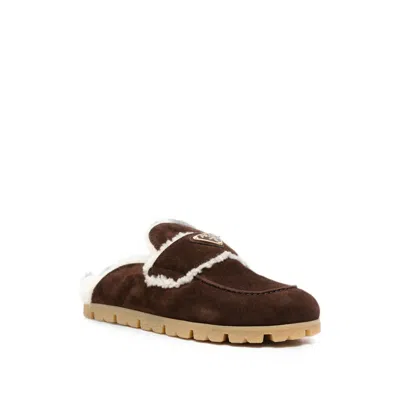 Prada Shearling-trim Logo-plaque Suede Mules In Brown