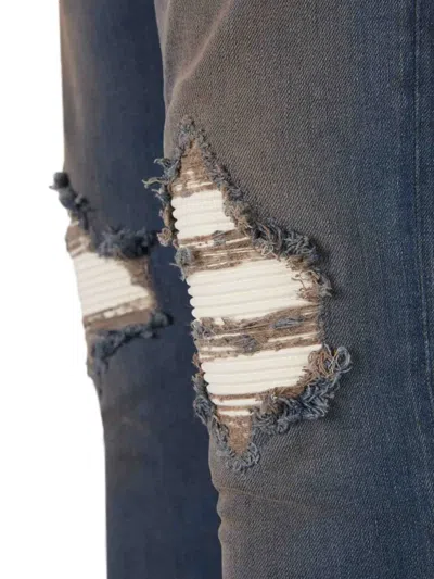 Amiri Distressed Ribbed-panel Jeans In Blue