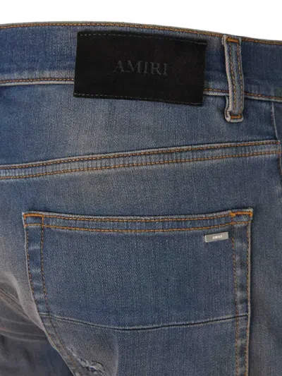 Amiri Distressed Ribbed-panel Jeans In Blue