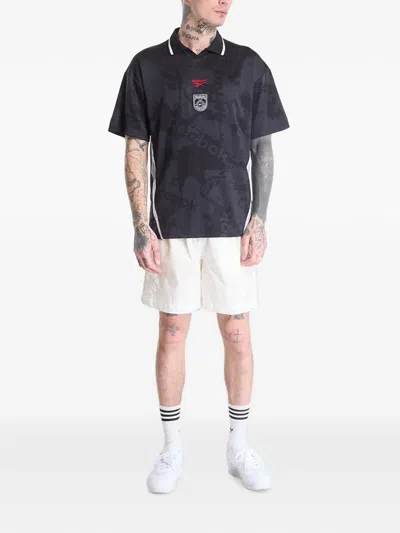 Reebok Logo-print Collared T-shirt In Black