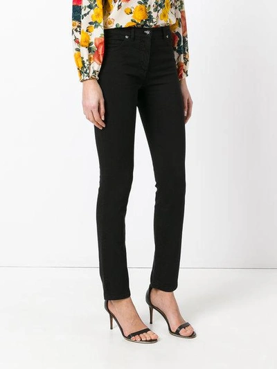 Shop Versace Skinny Jeans In Black