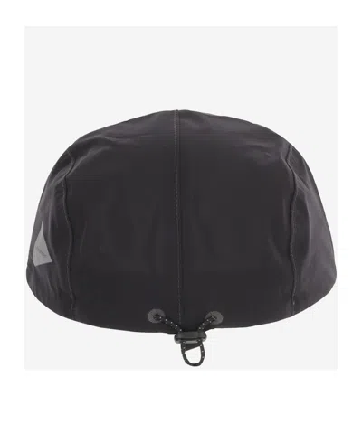 And Wander Drawstring Hat In Black