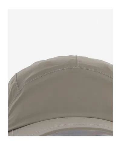 And Wander Drawstring Hat In Gray