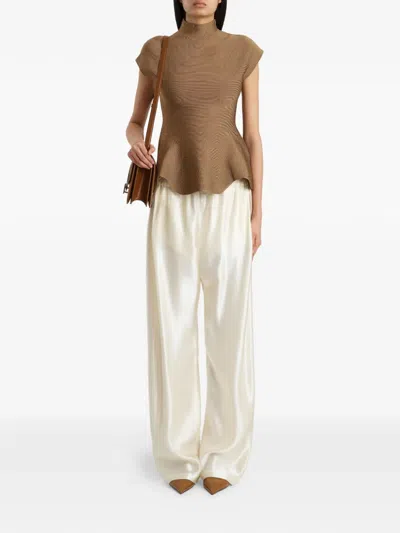Khaite Andra Stretch-knit Turtleneck Peplum Top In Brown