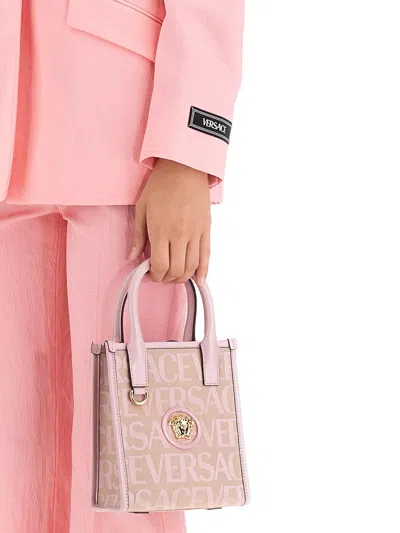 Versace Single-breasted All Over Logo Jacket In Pink