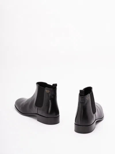 Prada Pull-tab Ankle Boot In Black