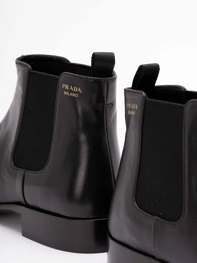 Prada Pull-tab Ankle Boot In Black