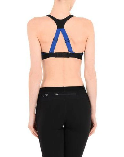 Shop Puma Sports Bras And Performance Tops In Blue