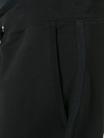 Shop Moncler Piped Track Pants - Black