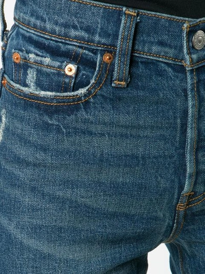 Shop Levi's Raw Hem Cropped Jeans In Blue