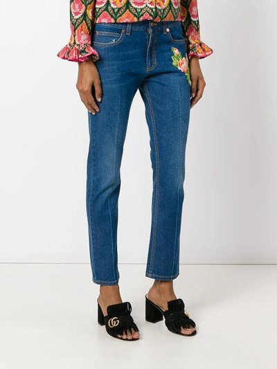 Shop Gucci Embroidered Jeans