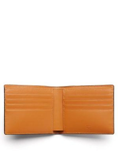 Shop Mcm Claus Coated Canvas Wallet In Na