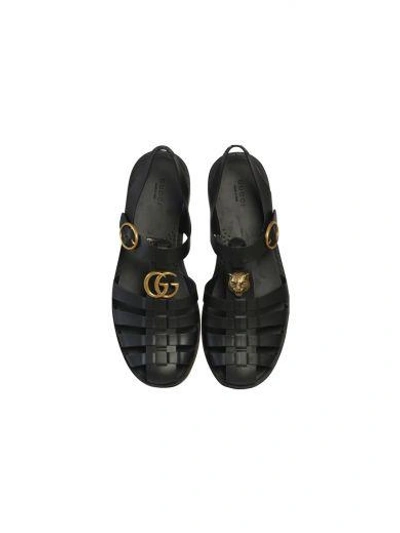 Shop Gucci Rubber Buckle Strap Sandal In Black