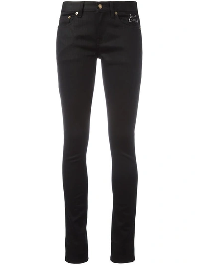 Saint Laurent Raw Low Waisted Skinny Jeans In Black