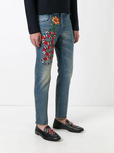 Shop Gucci Snake Embroidered Slim-fit Jeans