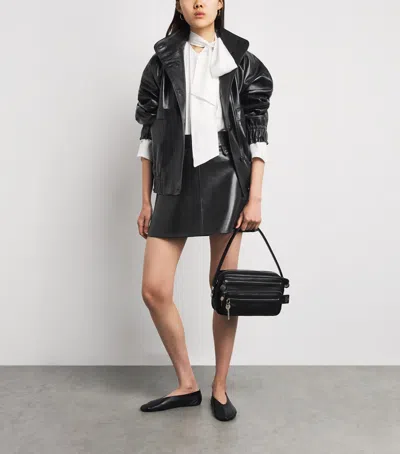 Sandro Paris Oversized Glossy Leather Jacket In Black