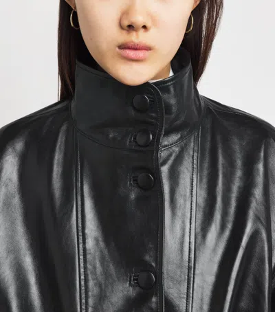Sandro Paris Oversized Glossy Leather Jacket In Black