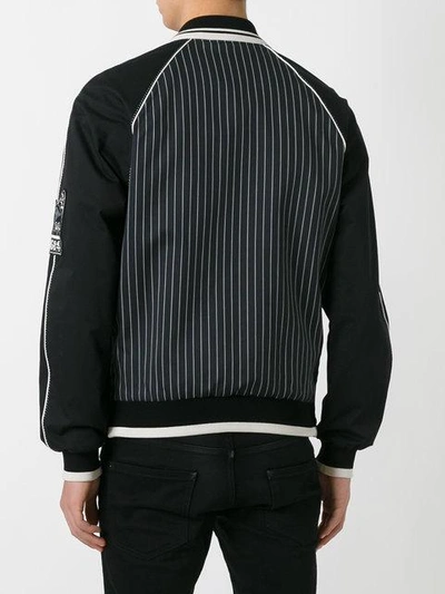 Shop Dolce & Gabbana Musical Patch Striped Bomber In Black