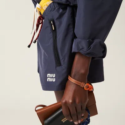 Miu Miu Drawstring Zip-pocket Shorts In Blue