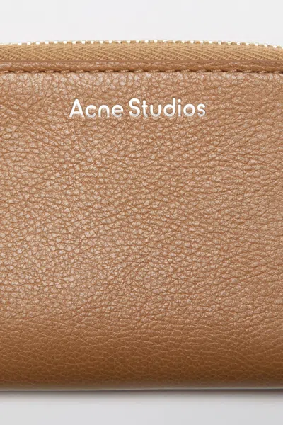 Acne Studios Compact Zip Wallet In Brown