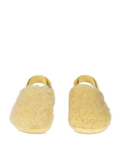 Marni Shearling And Leather Mules In Yellow