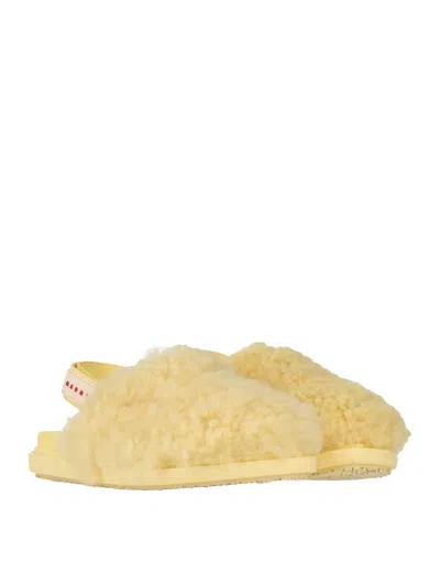 Marni Shearling And Leather Mules In Yellow