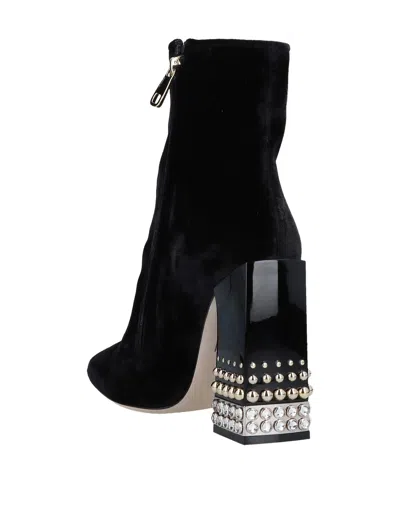 Dolce & Gabbana Solid Color Ankle Boots In Black