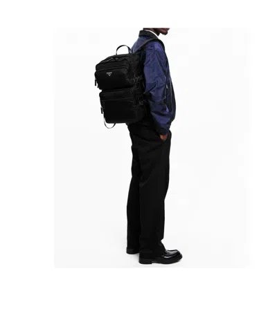 Prada Triangular Logo Backpack In Blue