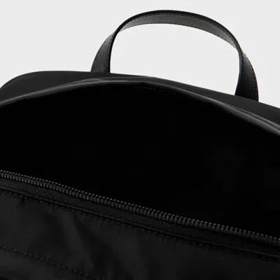 Prada Triangular Logo Backpack In Blue