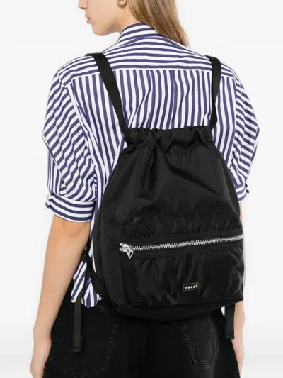 Sacai Drawstring Zip-pocket Backpack In Brown