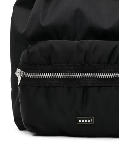 Sacai Drawstring Zip-pocket Backpack In Brown