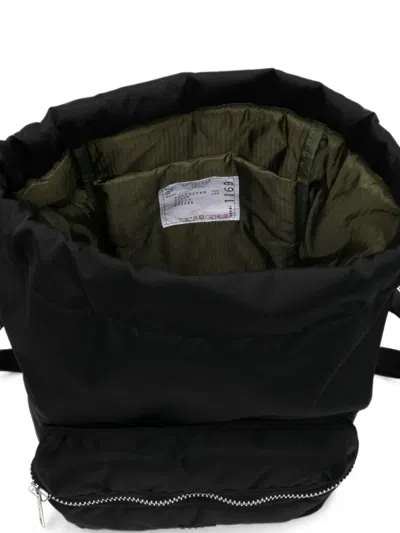 Sacai Drawstring Zip-pocket Backpack In Brown
