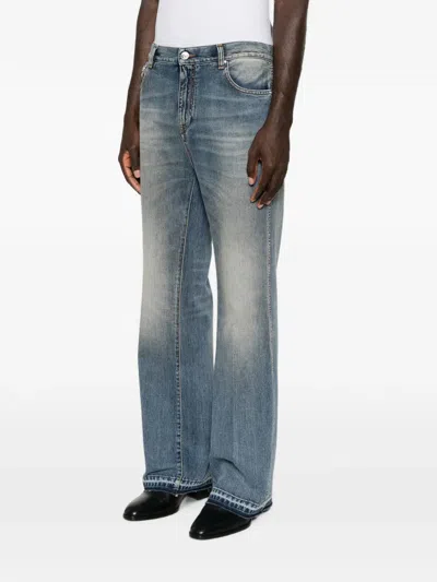 Amiri Faded-effect Bootcut Jeans In Blue