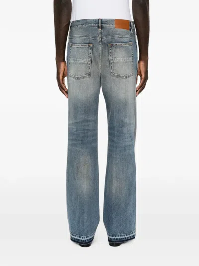 Amiri Faded-effect Bootcut Jeans In Blue