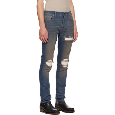 Amiri Distressed Ribbed-panel Jeans In Blue
