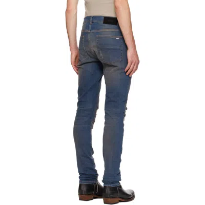 Amiri Distressed Ribbed-panel Jeans In Blue