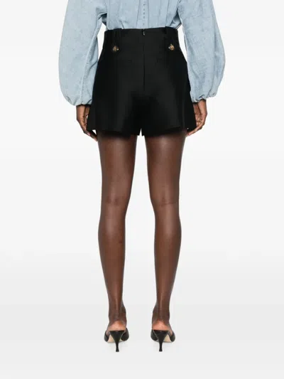 Zimmermann Valiant Tailored Button-embellished Pleated Shorts In Black