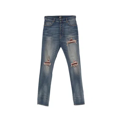 Amiri Distressed Patchwork Jeans In Blue