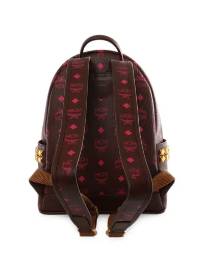 Mcm Stark Monogram-print Studded Backpack In Brown