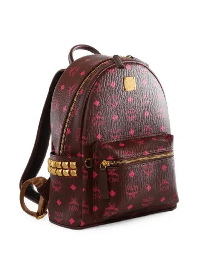 Mcm Stark Monogram-print Studded Backpack In Brown