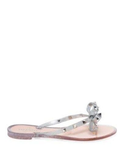 Shop Valentino Rockstud Metallic Jelly Thong Sandals In Silver