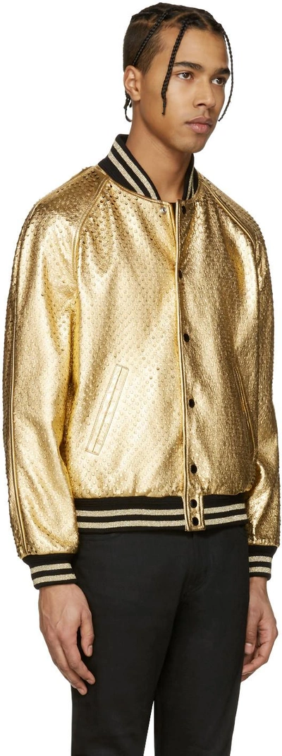 Shop Saint Laurent Gold Perforated Leather Bomber Jacket