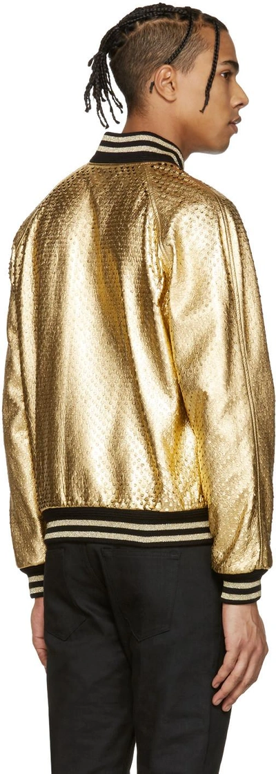 Shop Saint Laurent Gold Perforated Leather Bomber Jacket